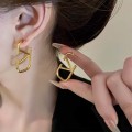 Gold unique letter earrings