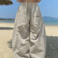 High-waisted pleated wide-leg trousers