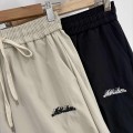 High-waisted pleated wide-leg trousers